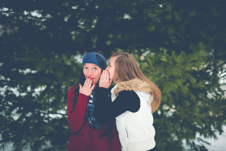 Introverts in leadership -2 girls telling secrets